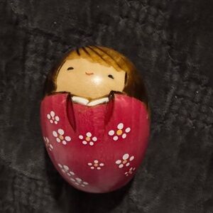 Hand-Painted Japanese kokeshi egg shaped doll in pink floral dress.